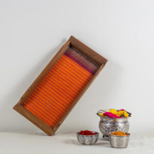 Small tray inlaid with a fanta orange Kanchipuram silk with a deep maroon border.