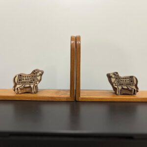 bookend has cow shaped block printing blocks on a 100 year old Burma teak.