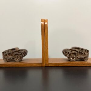 100 year old Burma teak book ends embellished with car shaped block printing blocks.